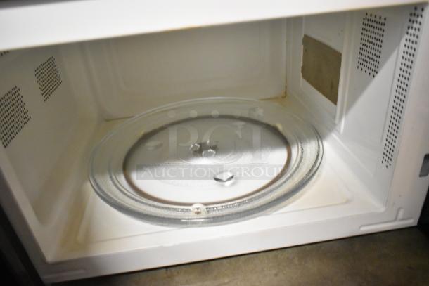 Walmart MS54100112162 countertop microwave interior with glass plate, showing clean condition. 120 volts, 1 phase.