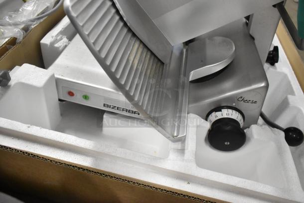 2018 Bizerba GSP H commercial meat slicer, metal body, 120V, pristine in foam packaging, dial for thickness adjustment.