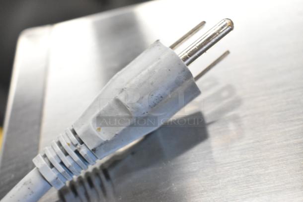 2018 Bizerba GSP H meat slicer power plug, 3-prong, shows wear. 120 volts, 1 phase. Suitable for commercial use.