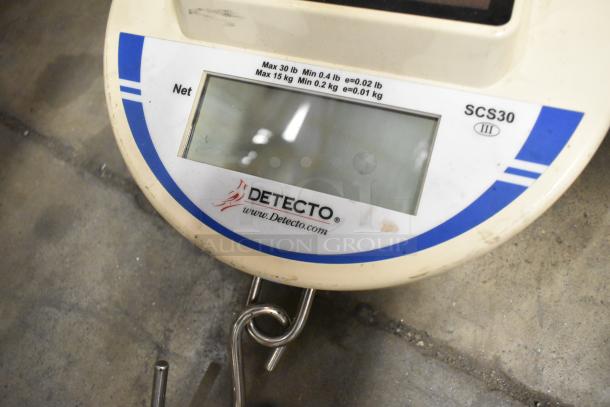 Detecto SCS30 hanging produce scale, 30 lb capacity, visible hook, minor wear on casing, clear display.