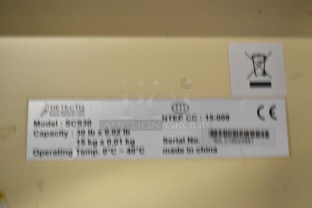 3 Detecto SCS30 hanging produce scales, 30 lb capacity each, model label shows CE marking, made in China.