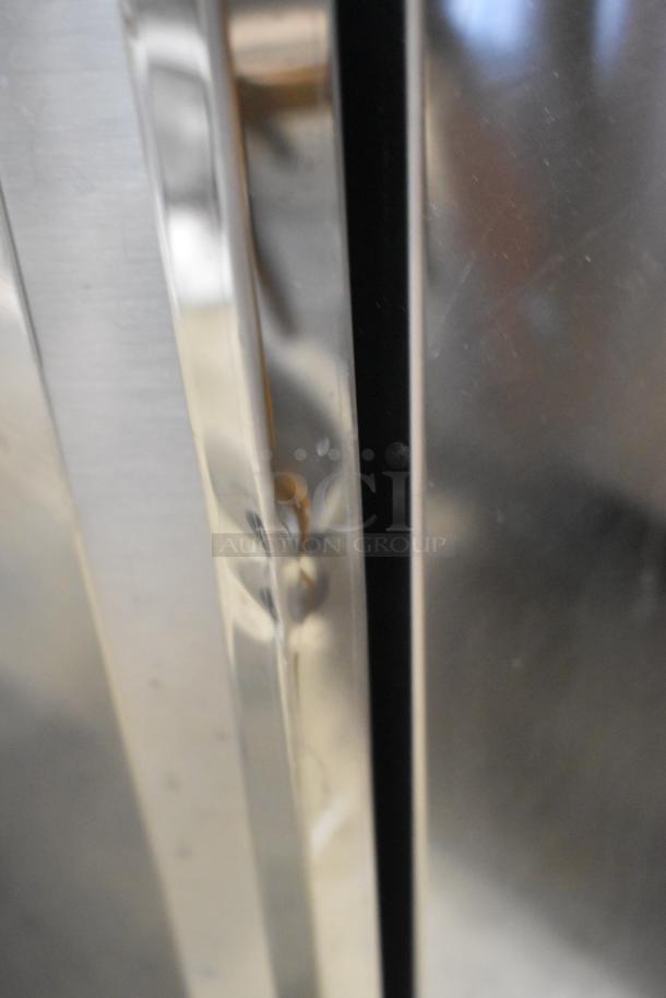Stainless steel surface of Easy Hardware Hybrid 684 sink, showing minor blemishes. Commercial design with casters.