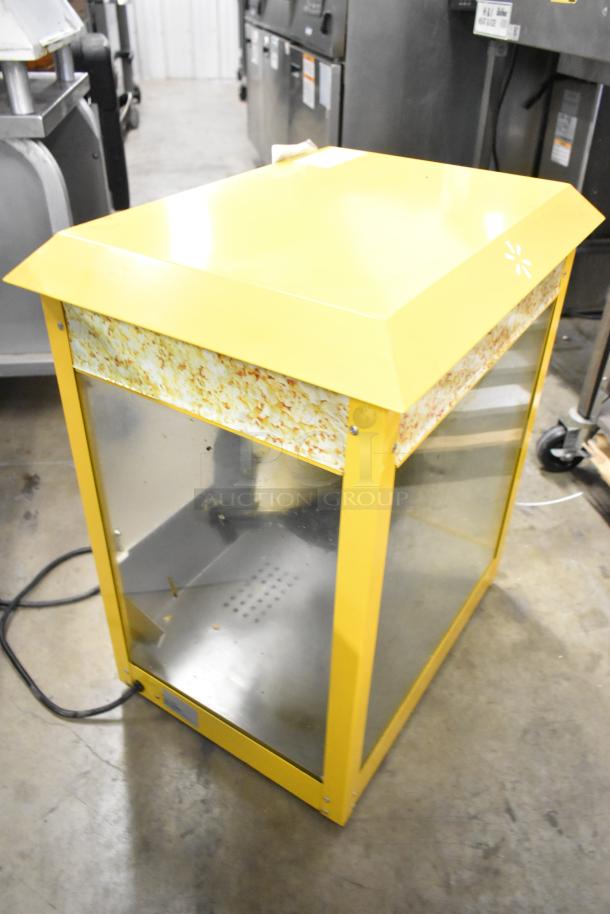 2019 OY-828 yellow metal countertop popcorn machine, 110 volts, 1 phase. Features popcorn graphics and glass panels.