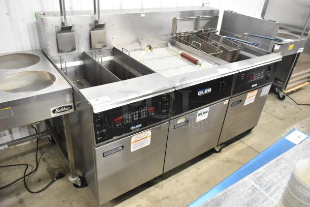 Giles EOF-24 stainless steel 2 bay deep fat fryer with center dumping station, commercial casters, 480V, 3 phase.