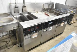 Giles EOF-24 stainless steel 2 bay deep fat fryer with center dumping station, commercial casters, 480V, 3 phase.