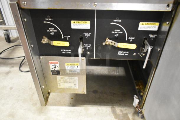 Giles EOF-24 stainless steel 2 bay deep fat fryer, with center dumping station, commercial casters, 480 volts, 3 phase.