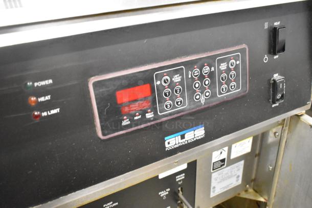 Giles EOF-24 stainless steel commercial fryer, dual bay, center dumping, control panel, 480V, 3-phase, on casters.