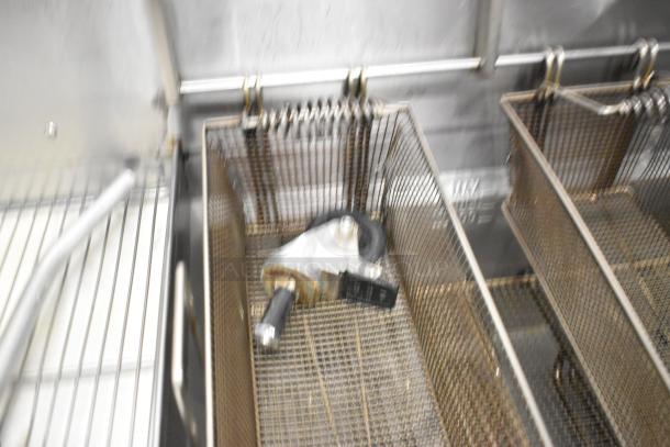 Giles EOF-24 stainless steel commercial fryer, 2 bay, center dumping, on casters, 480V, 3 phase, visible components.