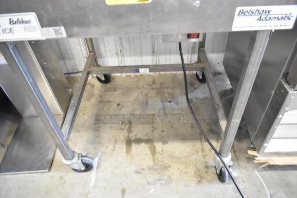 Belshaw H&I-4 stainless steel commercial glazing station with casters, 208-240 volts, 1 phase, in used condition.