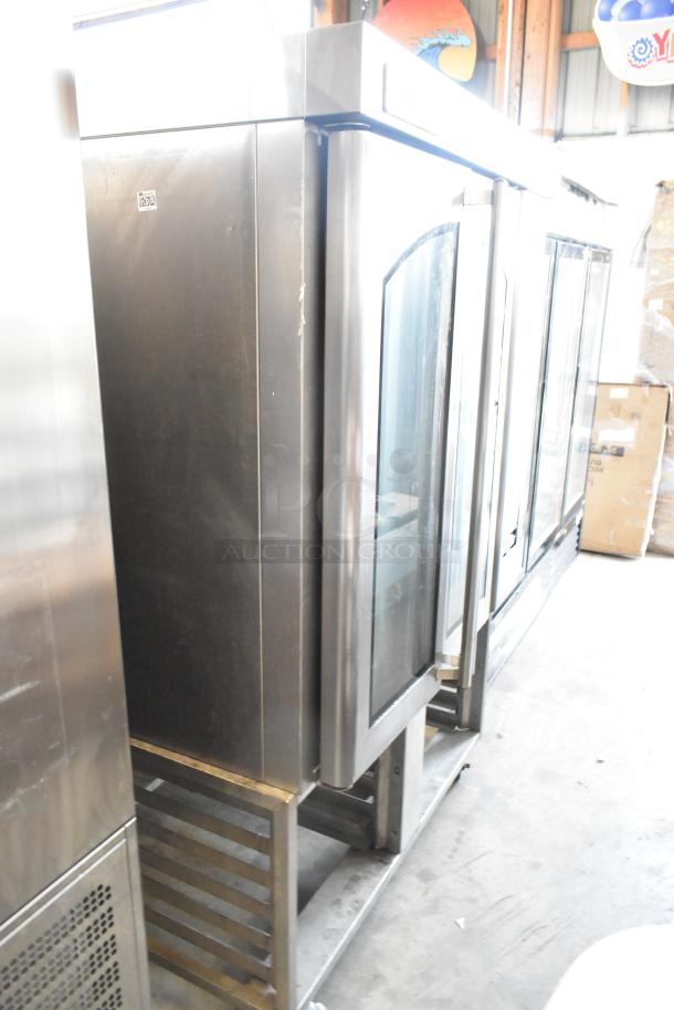 Baxter stainless steel commercial mini rotating rack oven, natural gas, dual pan rack, on commercial casters, visible wear.