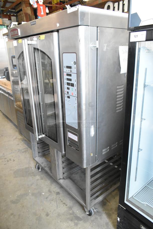 Baxter stainless steel commercial natural gas mini rotating rack oven with dual pan rack on casters, excellent condition.