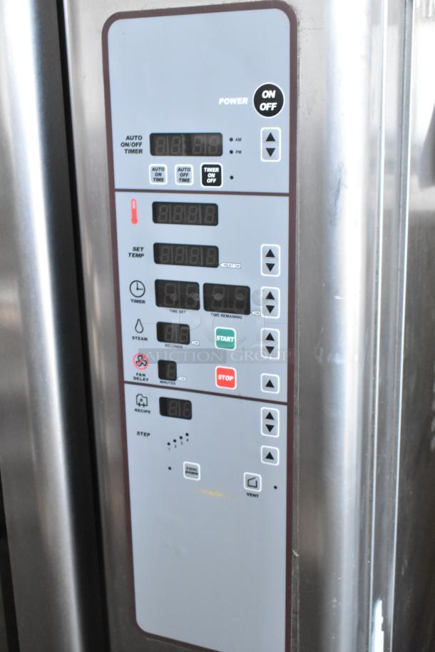 Baxter stainless steel commercial mini rotating rack oven, digital controls, natural gas powered, dual pan rack, on casters.