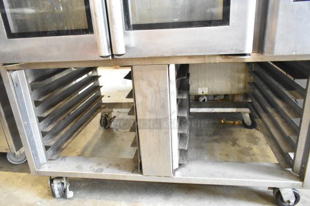 Baxter stainless steel mini rotating rack oven, natural gas powered, dual pan rack, commercial casters, used condition.
