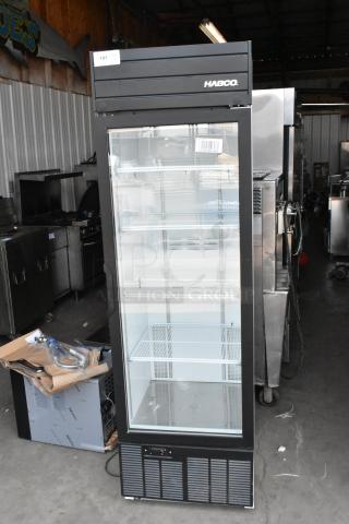 2019 Habco SE18 single door cooler merchandiser with poly coated racks; black exterior, clear glass door showing interior shelves. 115V, 1 phase.
