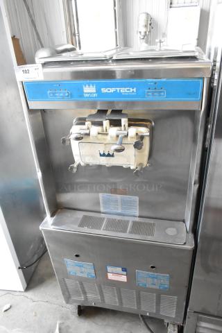 Taylor 754-27 stainless steel soft serve ice cream machine, two flavors with twist, on commercial casters, 208/230V, 1 phase.