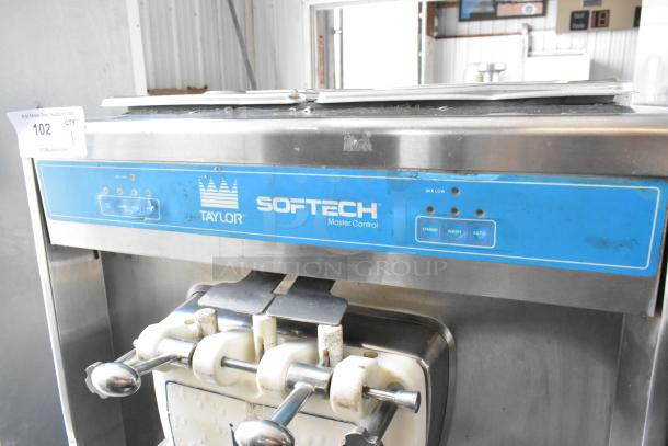 Taylor 754-27 stainless steel soft serve ice cream machine, 2-flavor w/ twist, commercial casters, 208/230V, 1 phase.