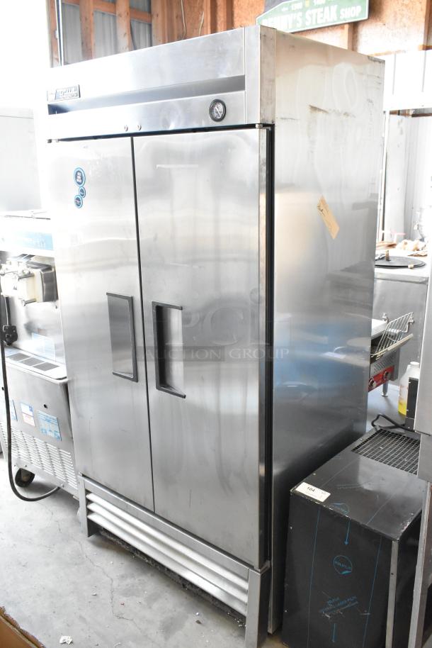 True T-35 stainless steel commercial 2-door reach-in cooler with poly-coated racks, 115 volts, 1 phase, visible temperature gauge.