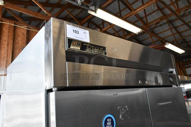 True T-35 2-door stainless steel commercial cooler with poly coated racks, 115V, 1 phase. Model tag visible.