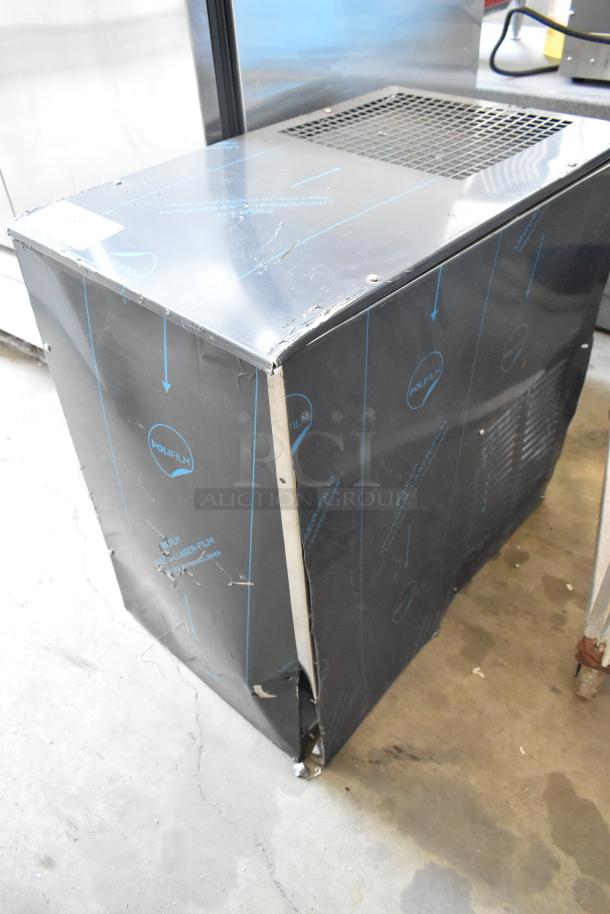 Cornelius WCC700-A stainless steel ice machine, 115 volts, 1 phase. New, with protective film, some surface dents.