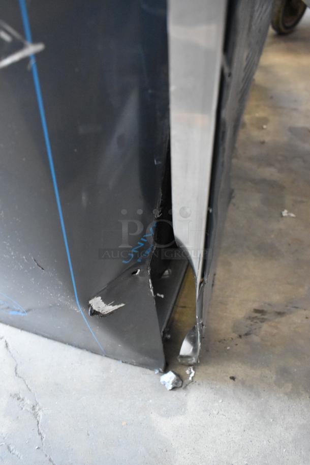 Cornelius WCC700-A commercial ice machine, stainless steel, 115 volts, 1 phase; visible exterior damage on lower panel.
