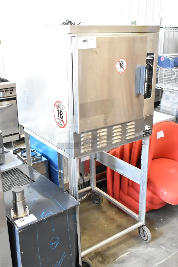 Hobart HC24EA5 stainless steel steam cabinet on stand with casters, 208/240V, 3/1 phase, commercial-grade.