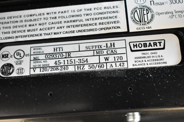 2016 Hobart HTi commercial food scale label, model HTi, 120/208-240V, 1-phase, serial 45-1151-354, NSF/UL certified.