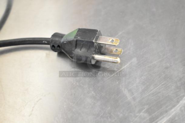 2016 Hobart HTi scale power plug, 120/208-240V, 1 phase. Black cord on metal surface, ideal for commercial use.