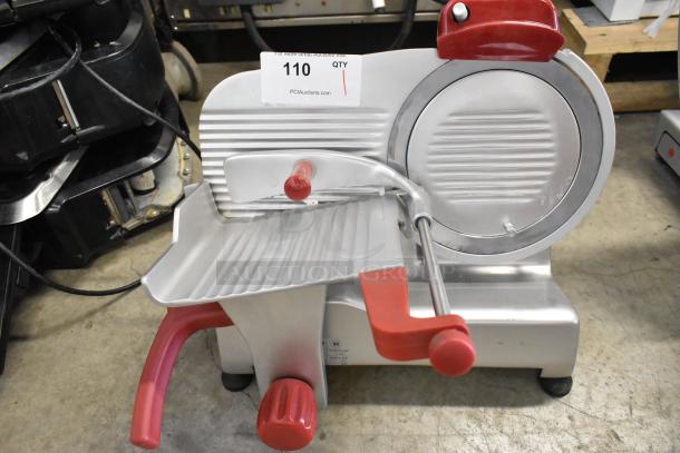 Berkel B9-SLC stainless steel commercial meat slicer with blade sharpener. Features red accents, 115 volts, and in good condition.