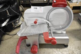 Berkel B9-SLC stainless steel commercial meat slicer with blade sharpener. Features red accents, 115 volts, and in good condition.