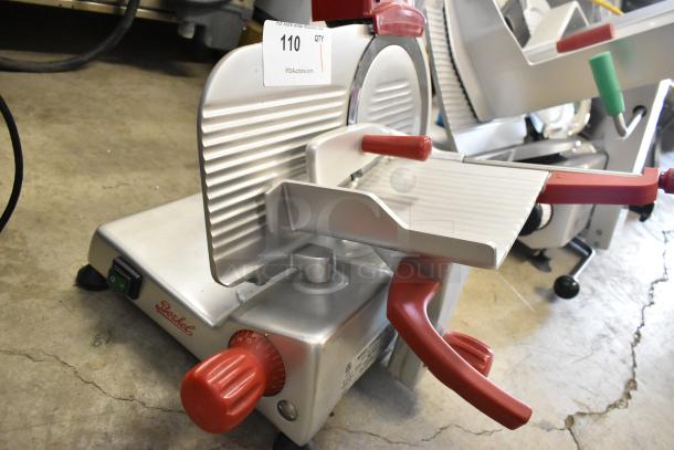 Berkel B9-SLC stainless steel meat slicer with built-in blade sharpener, red adjustment knobs, 115 volts, 1 phase.