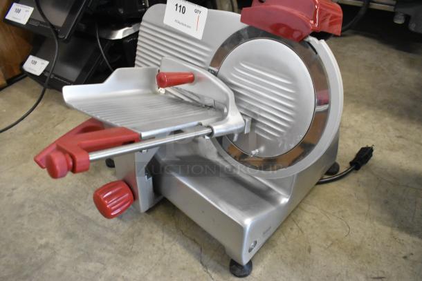 Berkel B9-SLC stainless steel meat slicer with blade sharpener, 115 volts, excellent condition, suitable for commercial use.