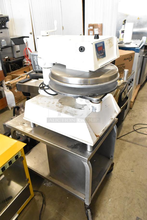 DoughPro commercial countertop dough press on stainless steel stand, 115V, 1 phase. Used condition, visible wear. Model label visible.