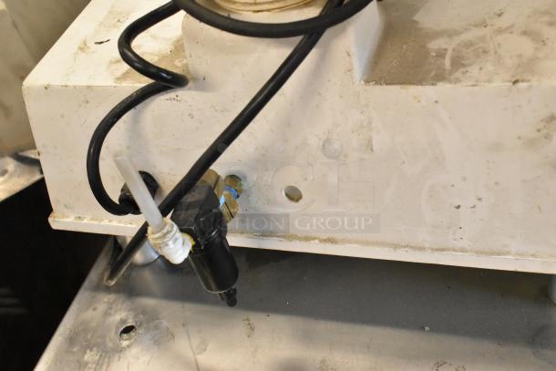 DoughPro metal commercial countertop dough press on stainless steel stand, showing power cable and connection details. 115V, 1 phase.