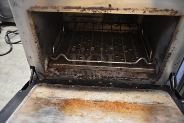 Turbochef NGO commercial rapid cook oven, 208/240V, 1 phase, visible wear, interior view showing racks and slight rust.