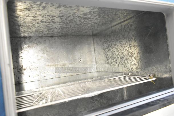 Brand new 2022 Master-Bilt DC-4D commercial chest freezer, metal interior, 115 volts, 1 phase, shown with shelving.