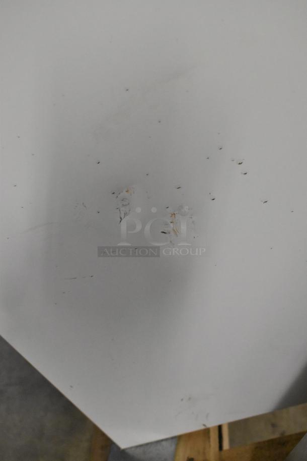 Brand new 2022 Master-Bilt DC-4D commercial chest freezer. Metal body, 115V, 1 Phase. Minor surface imperfections visible.