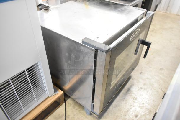 Unox Cadco XAV305 stainless steel convection oven, electric, 208-240 volts, commercial countertop model, visible wear.