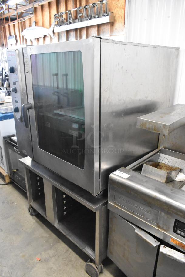 Rational SelfCooking Center stainless steel combi convection oven on double pan rack with commercial casters, used condition.
