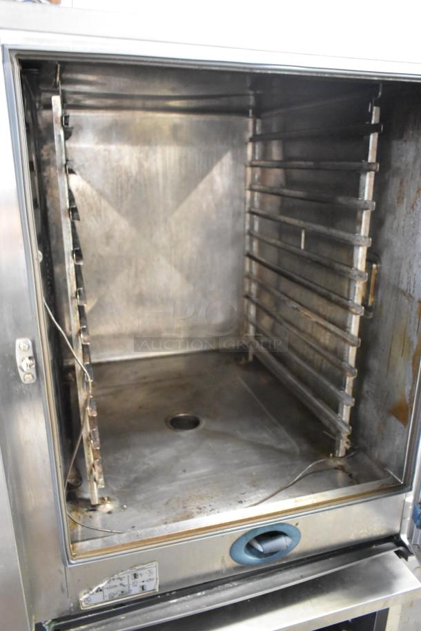 Rational SelfCooking Center stainless steel combi convection oven on double pan rack stand, commercial casters, used.