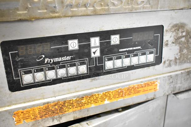Frymaster FMPH255CSC commercial fryer control panel, showing buttons and display. Slight wear visible on stainless steel surface.