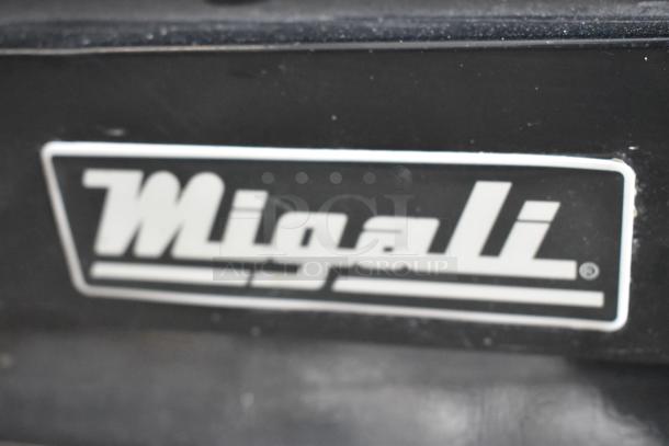 Migali C-72FM label, black background with white text, part of the commercial 3-door reach-in freezer merchandiser.