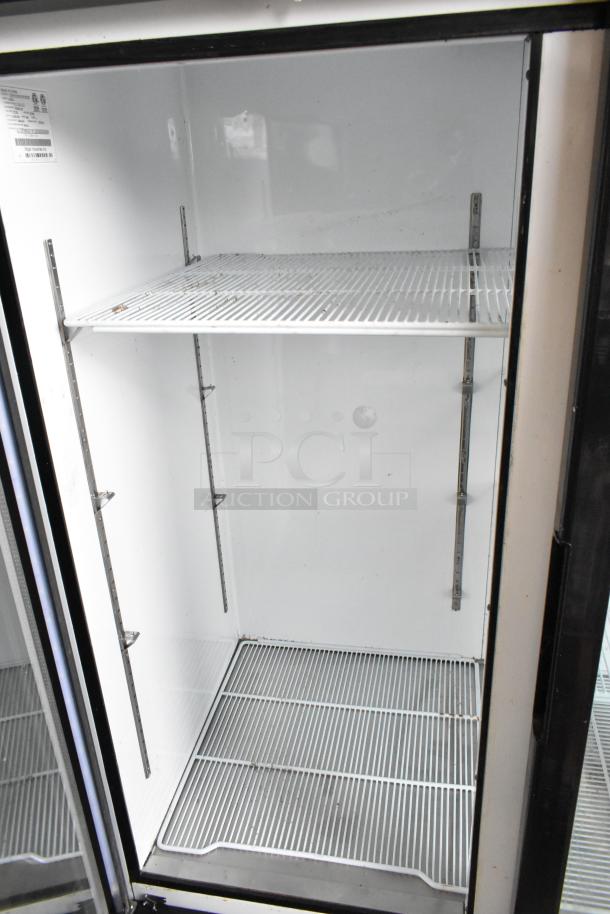 2018 Migali C-72FM 3-door reach-in freezer, poly-coated racks, metal, V:115/208-230, 1 phase, clean interior.
