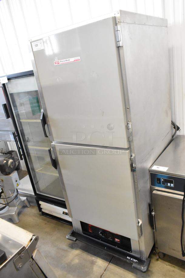 Metro C199-M(1)N-B heated holding cabinet, metal, two half-size doors, commercial casters, 120V, 1 phase, FlavorHold label.