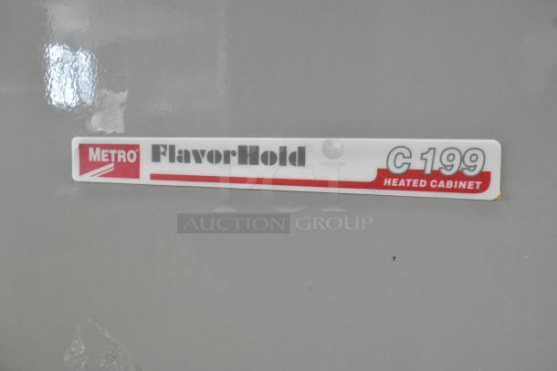Metro C199 FlavorHold heated cabinet label, model C199-M(1)N-B, white and red with brand marking visible.