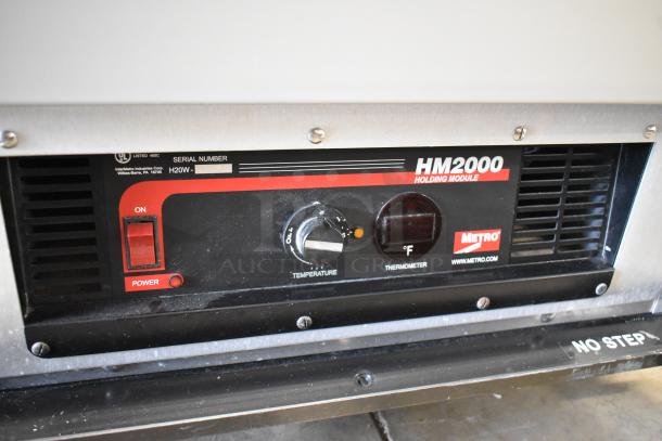 Metro C199-M(1)N-B Heated Holding Cabinet, 2 half-size doors, HM2000 holding module, temp control, commercial casters.