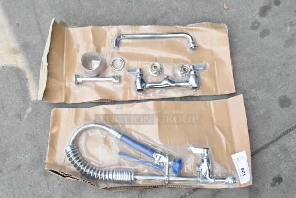 BRAND NEW SCRATCH AND DENT Waterloo Faucet with spray nozzle, chrome finish, complete set on cardboard packaging, minor blemishes.