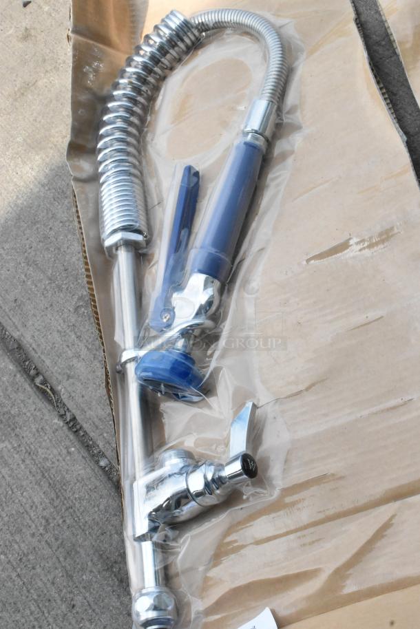 Brand new Waterloo faucet with spray nozzle, minor scratches. Silver finish, packaged in plastic. Includes mounting hardware.