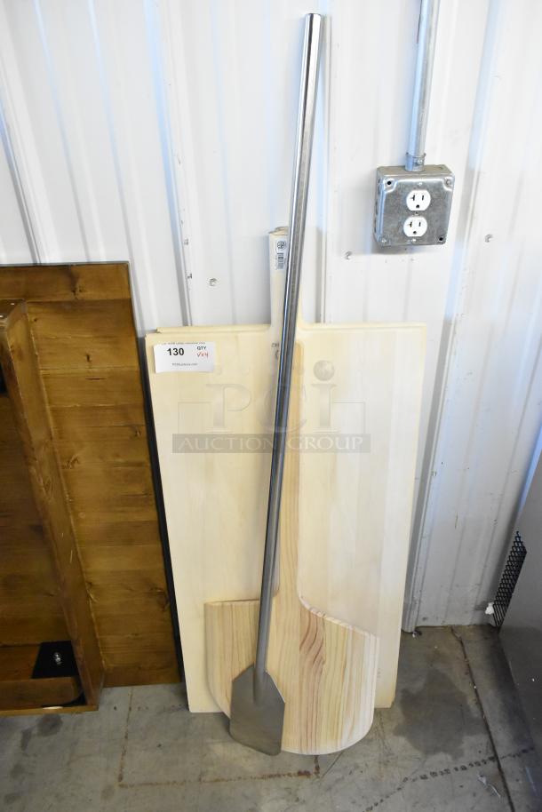 Four new kitchen items including a metal mixing paddle with long handle, Update WPP-1436 pizza peel, and two American Metalcraft 18"x42" wood pizza peels.