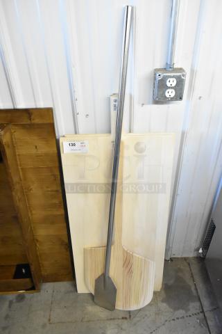 Four new kitchen items including a metal mixing paddle with long handle, Update WPP-1436 pizza peel, and two American Metalcraft 18"x42" wood pizza peels.