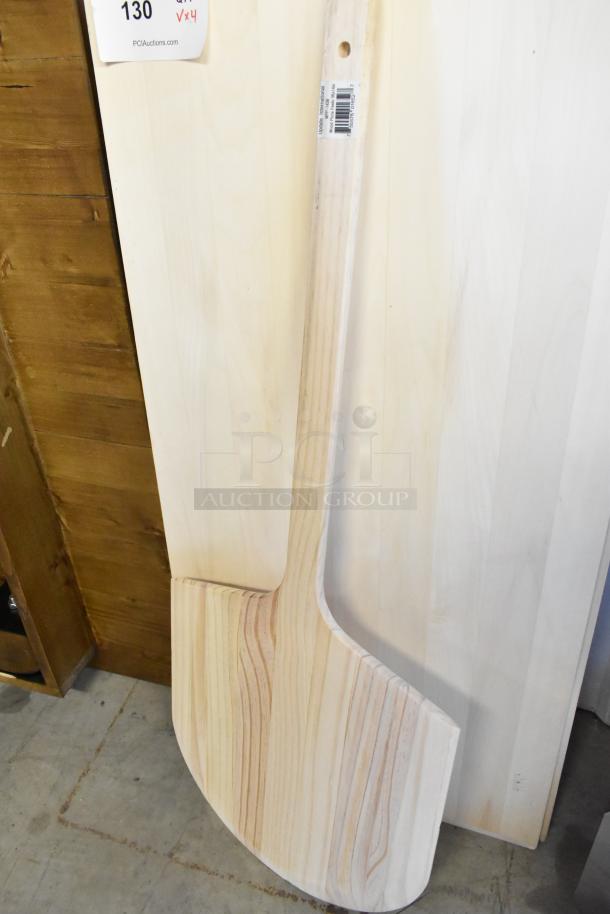 Brand new American Metalcraft 18"x42" wood pizza peel with 6.5" handle, showing light wood grain and intact label.